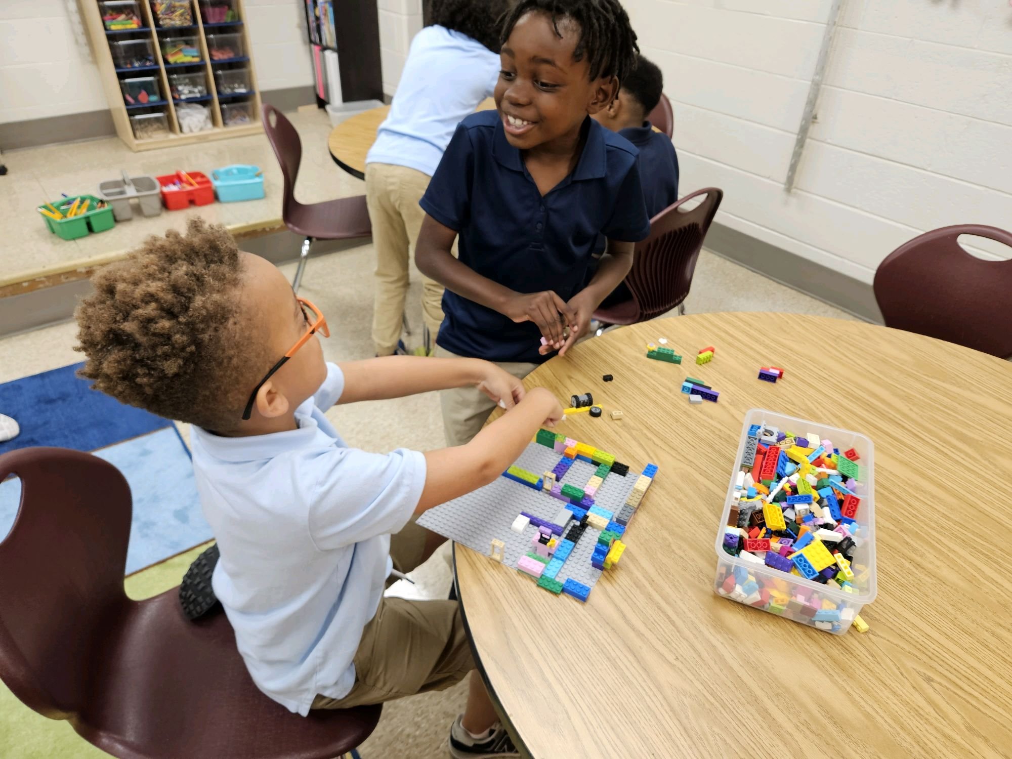 Students building with LEGO bricks at Westside